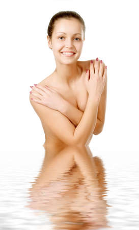 Perfect female torso. On a white background with reflection in waterの写真素材