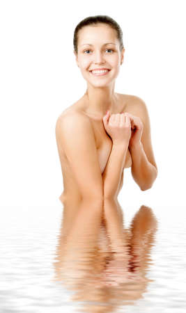 Perfect female torso. On a white background with reflection in waterの写真素材