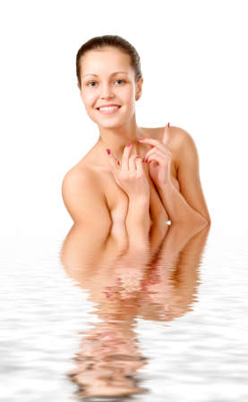 Perfect female torso. On a white background with reflection in waterの写真素材