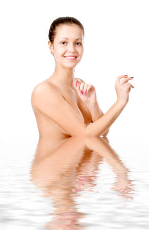 Perfect female torso. On a white background with reflection in waterの写真素材