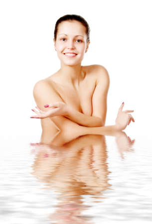 Perfect female torso. On a white background with reflection in waterの写真素材