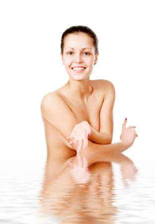 Perfect female torso. On a white background with reflection in waterの写真素材