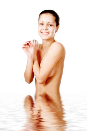 Perfect female torso. On a white background with reflection in waterの写真素材