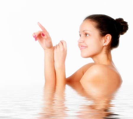 Perfect female torso. On a white background with reflection in waterの写真素材