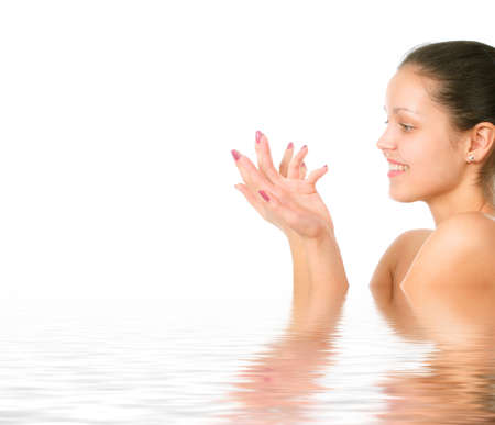 Perfect female torso. On a white background with reflection in waterの写真素材