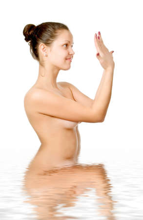 Perfect female torso. On a white background with reflection in waterの写真素材