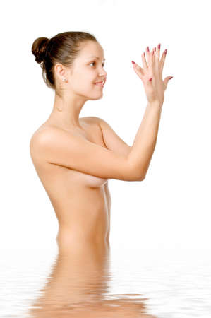 Perfect female torso. On a white background with reflection in waterの写真素材