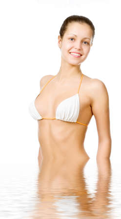 Beautiful young woman reflected in waterの写真素材