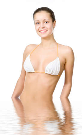 Beautiful young woman reflected in waterの写真素材