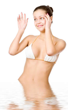 Beautiful young woman reflected in waterの写真素材