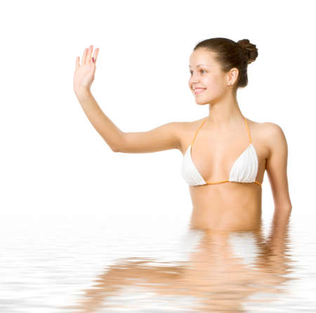 Beautiful young woman reflected in waterの写真素材