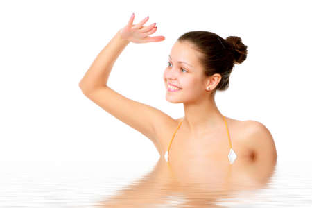 Beautiful young woman reflected in waterの写真素材