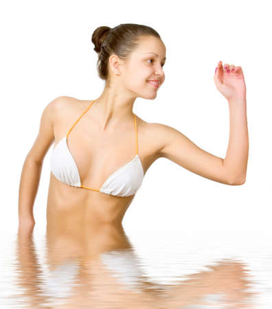 Beautiful young woman reflected in waterの写真素材