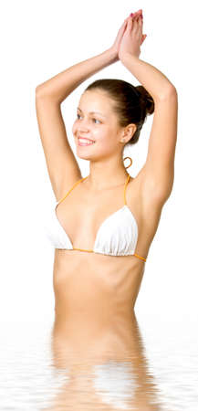 Beautiful young woman reflected in waterの写真素材