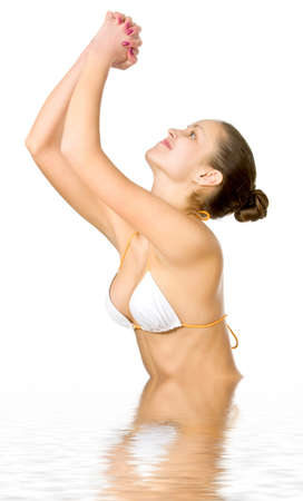 Beautiful young woman reflected in waterの写真素材