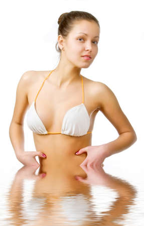 Beautiful young woman reflected in waterの写真素材