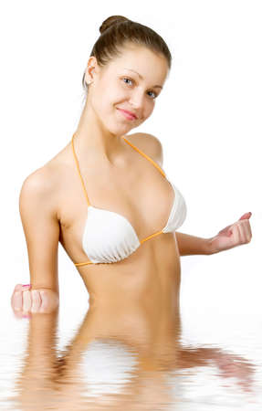 Beautiful young woman reflected in waterの写真素材