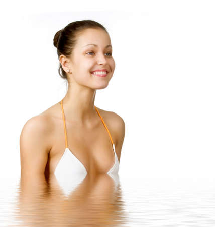 Beautiful young woman reflected in waterの写真素材