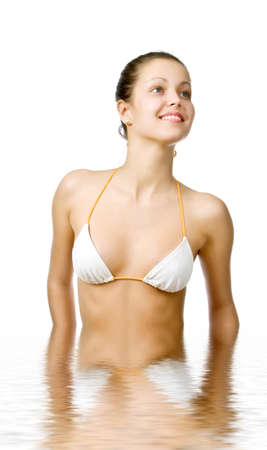 Beautiful young woman reflected in waterの写真素材