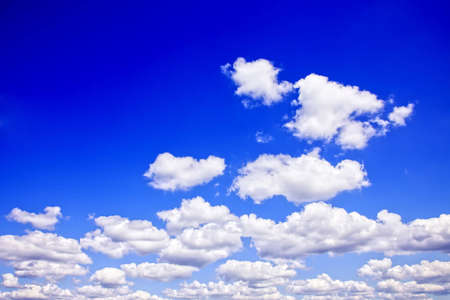 White clouds against a blue sky, lots of