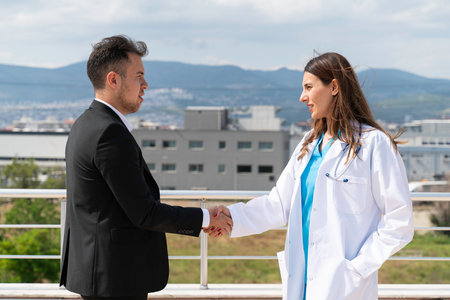 Portrait of Business Executive and Young Female Doctor Taking a Break and Engaging in Conversation