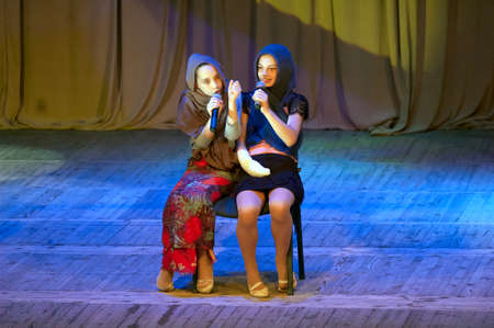 DNIPROPETROVSK, UKRAINE - May 22: Masha Lisyak and Asya Pashkovskaya, ages 12 years old, perform OLD...