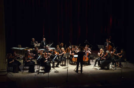 DNIPROPETROVSK, UKRAINE - JUNE 22, 2015:  FOUR SEASONS Chamber Orchestra - main conductor Dmitry Logvin perform at the State Russian Drama Theatreのeditorial素材