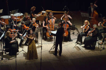 DNIPROPETROVSK, UKRAINE - JUNE 22, 2015: Famous flutist Olga Zernaeva and  FOUR SEASONS Chamber Orchestra - main conductor Dmitry Logvin perform at the State Russian Drama Theatreのeditorial素材