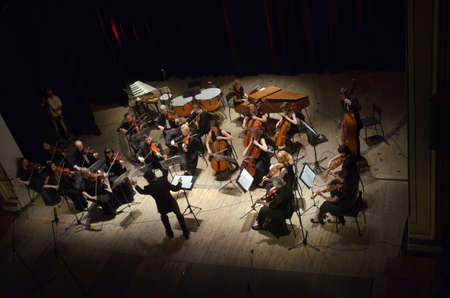 DNIPROPETROVSK, UKRAINE - JUNE 22, 2015:  FOUR SEASONS Chamber Orchestra - main conductor Dmitry Logvin perform at the State Russian Drama Theatreのeditorial素材