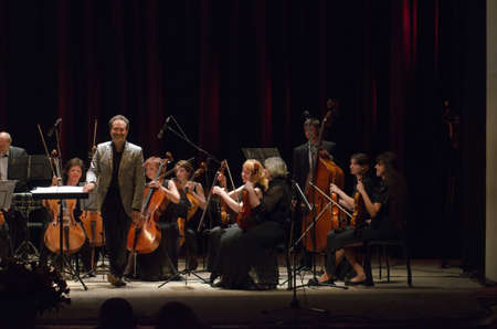 DNIPROPETROVSK, UKRAINE - JUNE 22, 2015:  FOUR SEASONS Chamber Orchestra - main conductor Dmitry Logvin perform at the State Russian Drama Theatreのeditorial素材