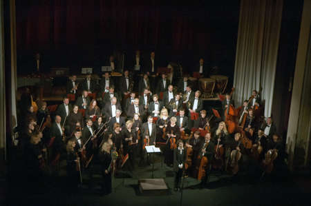 DNIPROPETROVSK, UKRAINE - FEBRUARY 9: Members of the Symphonic Orchestra - main conductor Natalia Ponomarchuk perform at the State Russian Drama Theatre on Feb. 9, 2015 in Dnipropetrovsk, Ukraineのeditorial素材