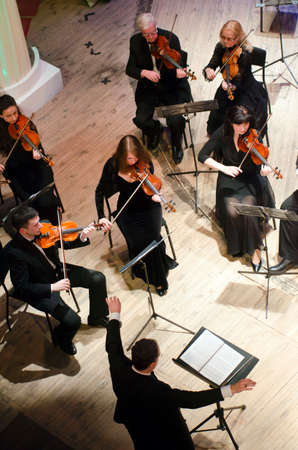 DNIPRO, UKRAINE - MARCH 20, 2017: FOUR SEASONS Chamber Orchestra - main conductor Dmitry Logvin perform at the State Drama Theatre.のeditorial素材
