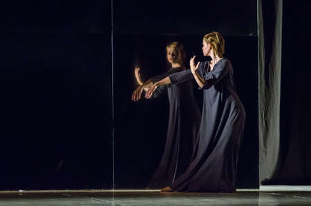 DNIPRO, UKRAINE - JUNE 6, 2017: Choreographic performance Mirror perform  by members of the Motion Mode Dance Theatre at the State Theater of Drama and Comedy.のeditorial素材