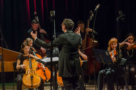 DNIPRO, UKRAINE - OCTOBER 22, 2018: FOUR SEASONS Chamber Orchestra - main conductor Dmitry Logvin perform  at the State Drama Theatre.のeditorial素材