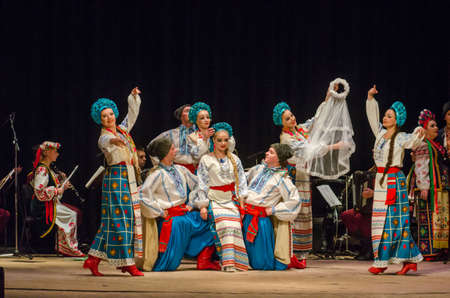 DNIPRO, UKRAINE - NOVEMBER 7, 2018: National traditions, customs and rites of the Ukrainian people performed by members of the Folklore Ensemble SLAVUTYCH  at the  State Drama  Theatre.のeditorial素材