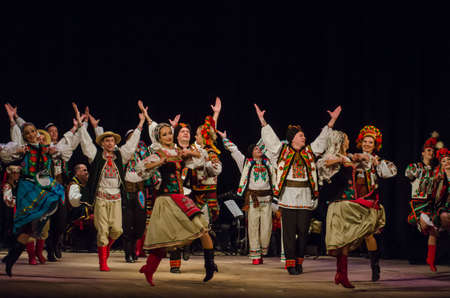 DNIPRO, UKRAINE - NOVEMBER 7, 2018: National traditions, customs and rites of the Ukrainian people performed by members of the Folklore Ensemble SLAVUTYCH  at the  State Drama  Theatre.のeditorial素材