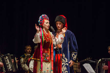 DNIPRO, UKRAINE - NOVEMBER 7, 2018: National traditions, customs and rites of the Ukrainian people performed by members of the Folklore Ensemble SLAVUTYCH  at the  State Drama  Theatre.のeditorial素材