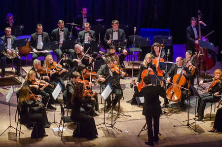 DNIPRO, UKRAINE - DECEMBER 17, 2018: FOUR SEASONS Chamber Orchestra - main conductor Dmitry Logvin perform at the State Drama Theater.のeditorial素材