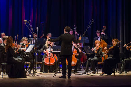 DNIPRO, UKRAINE - DECEMBER 17, 2018: FOUR SEASONS Chamber Orchestra - main conductor Dmitry Logvin perform at the State Drama Theater.のeditorial素材