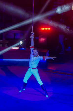 DNIPRO, UKRAINE - DECEMBER 14, 2018: Gymnast on the belts Yuri Kravchenko performs at the Circus.のeditorial素材