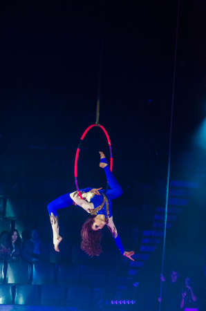 DNIPRO, UKRAINE - DECEMBER 14, 2018: Aerial gymnast Anna Rumyantseva performs at the Circus.