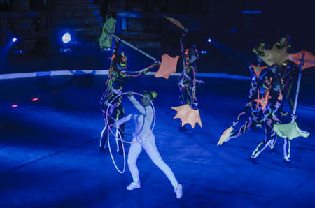DNIPRO, UKRAINE - DECEMBER 14, 2018: Members of the Melange-art studio perform Neon show at the Circus.のeditorial素材