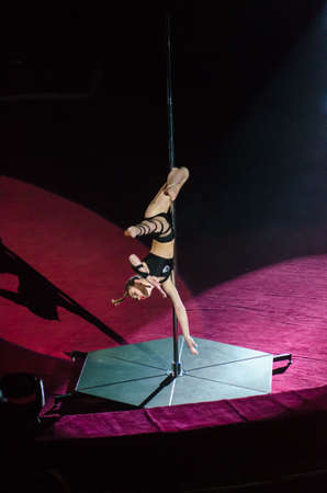 DNIPRO, UKRAINE - DECEMBER 14, 2018: Gymnast on a pylon Christina Kipko performs at the Circus.のeditorial素材