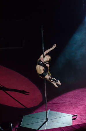 DNIPRO, UKRAINE - DECEMBER 14, 2018: Gymnast on a pylon Christina Kipko performs at the Circus.のeditorial素材