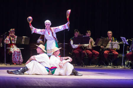 DNIPRO, UKRAINE - DECEMBER 5, 2019: National traditions, customs and rites of the Ukrainian people performed by members of the Folklore Ensemble SLAVUTYCH  at the  State Drama  Theatre.のeditorial素材