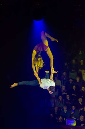 DNIPRO, UKRAINE - DECEMBER 13, 2019: Air gymnasts on the belts of Diana Nikitenko and Ottsov Alexei perform at the Circus.のeditorial素材