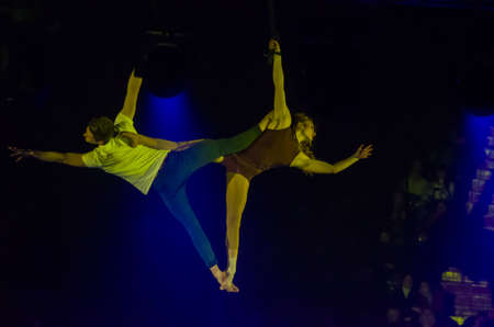 DNIPRO, UKRAINE - DECEMBER 13, 2019: Air gymnasts on the belts of Diana Nikitenko and Ottsov Alexei perform at the Circus.のeditorial素材