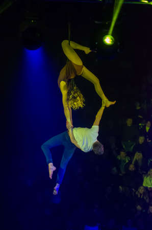 DNIPRO, UKRAINE - DECEMBER 13, 2019: Air gymnasts on the belts of Diana Nikitenko and Ottsov Alexei perform at the Circus.のeditorial素材