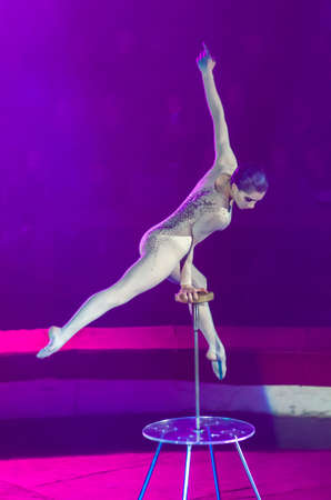 DNIPRO, UKRAINE - DECEMBER 13, 2019:  Plastic equilibrist Victoria Dzyuba performs at the Circus.のeditorial素材