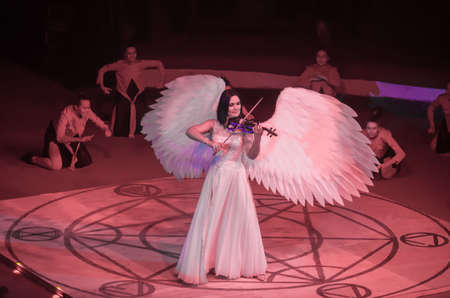 DNIPRO, UKRAINE - DECEMBER 13, 2019: Violinist Olga Avanesov  performs Angel at the Circus.のeditorial素材